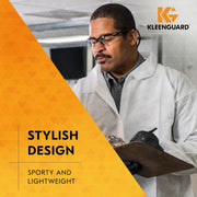 Person in a lab coat with KleenGuard V30 Nemesis 25676 safety glasses and text about stylish design.