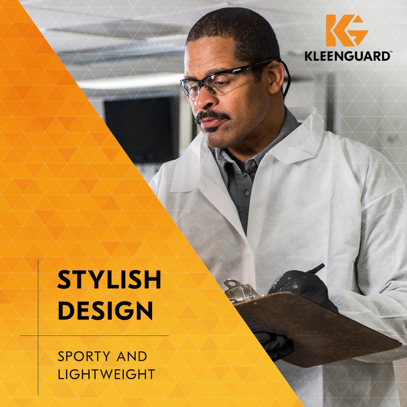 Person in a lab coat with KleenGuard V30 Nemesis 25676 safety glasses and text about stylish design.
