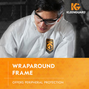 Person wearing a white protective suit with KleenGuard V30 Nemesis 25676 safety glasses, text about wraparound frame protection.