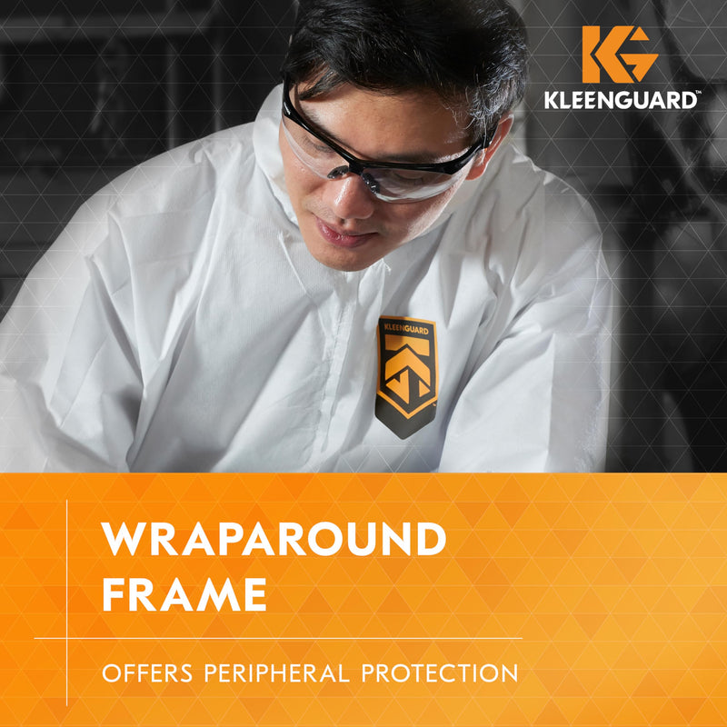 Person wearing a white protective suit with KleenGuard V30 Nemesis 25676 safety glasses, text about wraparound frame protection.