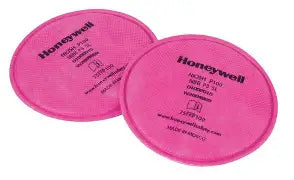Two pink North 75FFP100 P100 Respirator Filter on a white background